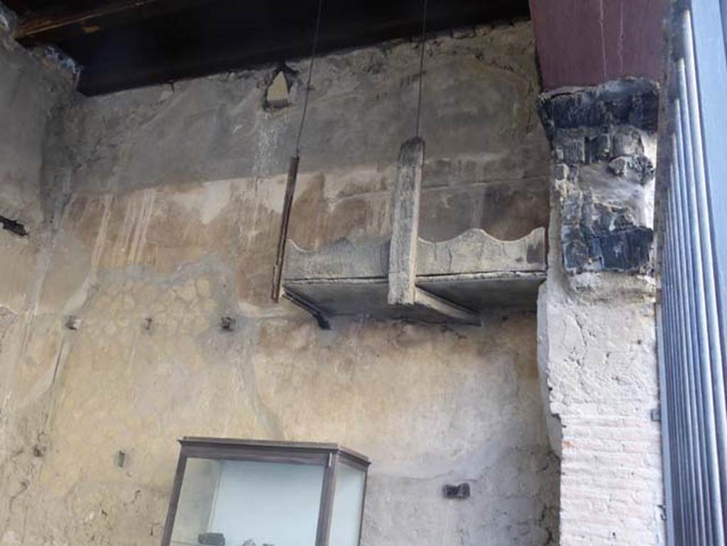 VI.12 Herculaneum, September 2015. West wall, against which is the still partly preserved shelving for storage or amphorae.